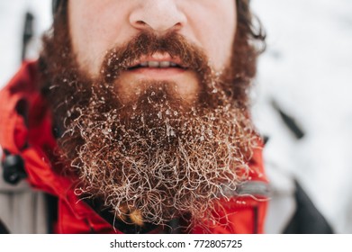 Man With Frozen Beard In Forest. Iced Beard. Close Up Frozen Beard.