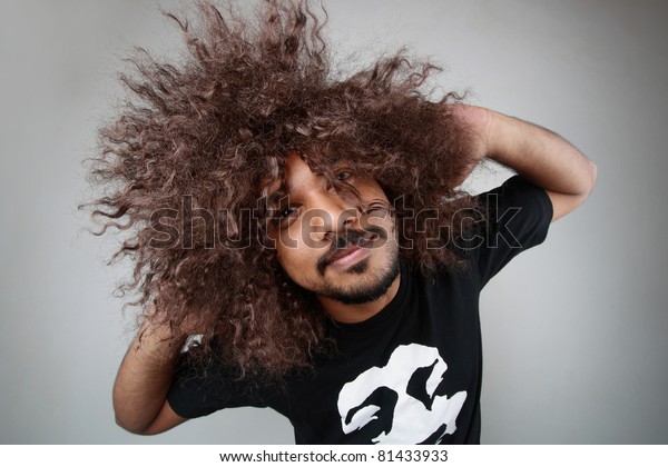 Man Funky Hairstyle Gives Unusual Pose Stock Photo Edit Now