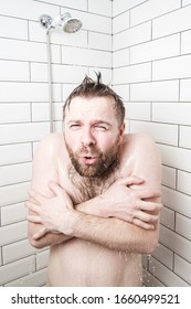 Man, With A Funny Expression On His Face, Feels Shocked At Taking A Cold Shower, He Froze And Tries To Cover His Body With Hands.