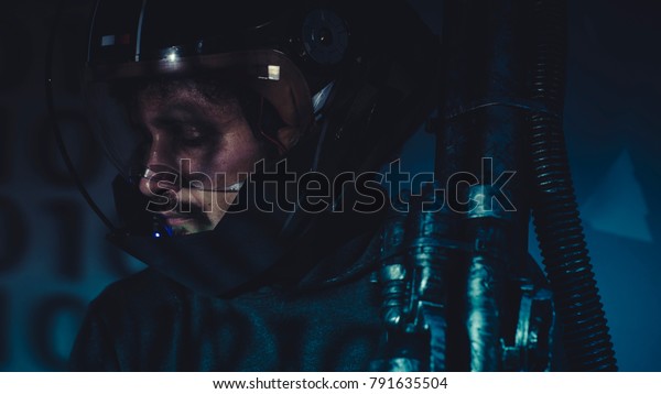 man of the future or\
space with futuristic helmet and fantasy lights, carries a laser\
weapon in his hands