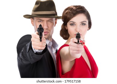 Man gangster and sexy spy woman with guns. Isolated on white background