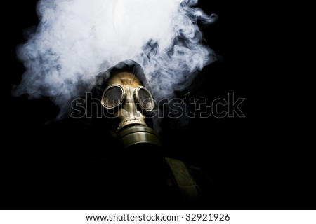 Man in gasmask with abstract smoke