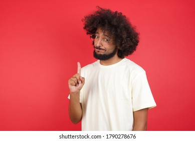 Man Gesturing A No Sign. Closeup Portrait Unhappy, Serious Guy Raising Finger Up Saying: Oh No You Did Not Do That. Standing Over Yellow Background. Negative Emotions Facial Expressions, Feelings.