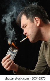 The man gets a light from a denomination, advantage hundred dollars