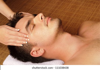 Man Getting A Facial / Face Massage At Day Spa