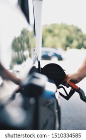 Man Is Getting Fuel For His Vehicle At A Gas Pump