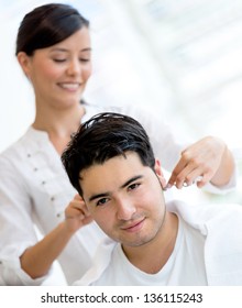 Man Getting A Haircut At The Hair Salon