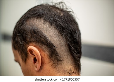 Man Getting A Self Haircut At Home