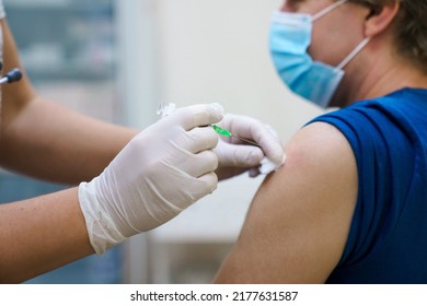 Man Getting Vaccinated Against Covid. Vaccination Routine, Adult Immunization Schedule. Seasonal Virus Protection, Monkeypox Vaccine. Outbreak Disease Prevention. Medical Nurse Hold Injection Syringe