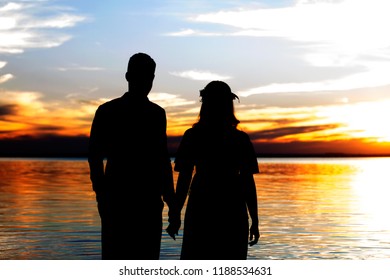 Man And A Girl In Sundown At Epitácio