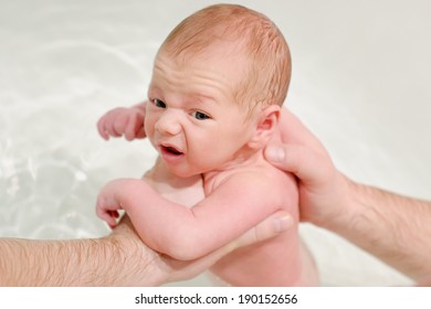 Man Give A Bath His Newborn Baby 