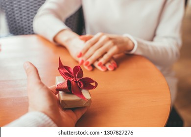 Man gives a present to his girlfriend - POV Image - follow me concept