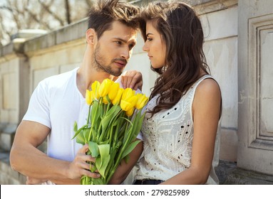 Man Giving Flowers Woman