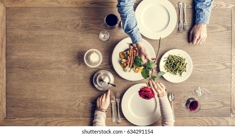 Man Giving A Rose For The Lady At Dinner