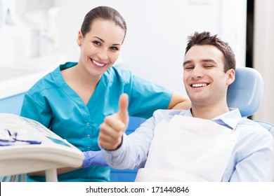 Man Giving Thumbs Up At Dentist Office 