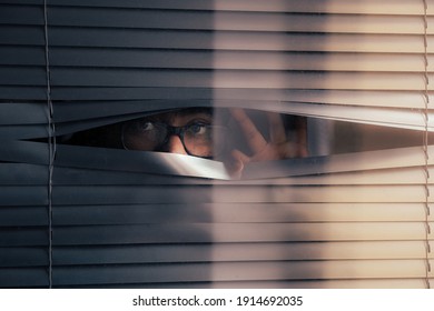 Man with glasses curiously waiting for something, person with anxiety   - Powered by Shutterstock