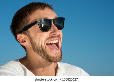 Man In Glasses Laughs With Open Mouth