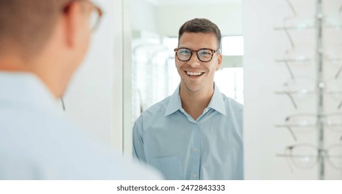 Man, glasses and mirror at store for eye care, vision and wellness for eyesight, smile and choice. Person, customer and check reflection with decision for optometry, happy and style at retail shop