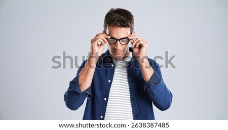 Man, glasses and touch in studio for optometry, vision or adjusting to new lens for sight. Person, prescription specs and testing on white background space for eye care, designer frames or healthcare