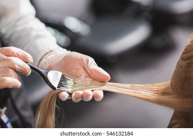 Man in gloves is dying hair - Powered by Shutterstock