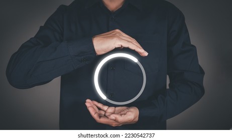 Man with glowing loading circle digital interface. 