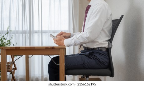 A Man With A Good Posture.A Man Who Uses A Smartphone.