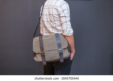 Man With A Gray Canvas Messenger Bag. Unisex Bag For Sale.