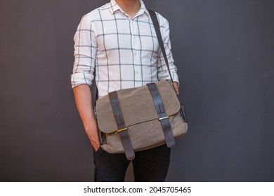 Man With A Gray Canvas Messenger Bag. Unisex Bag For Sale.