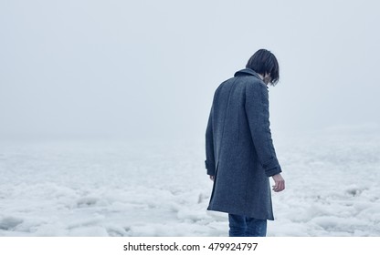 A Man In A Gray Coat Walking On The Sea In Winter, Emotions