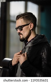 a man in a gray jacket