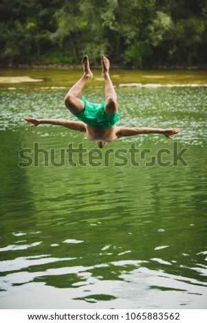 Similar – Image, Stock Photo Swimming fun at quarry pond, young adults swing into the water