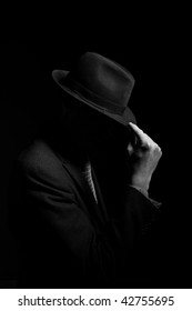 A Man In A Grey Hat On Black Background