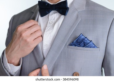 Man In Grey Suit, Plaid Texture, Blue Bowtie And Pocket Square, Close Up White Background