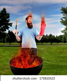 A Man Grilling With A Fire That's Too Big