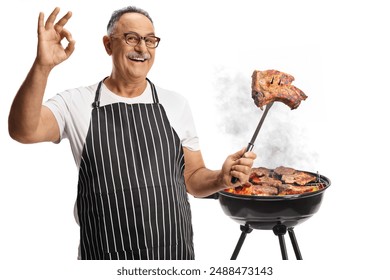 Man grilling meat on a barbecue and holding a steak on a fork isolated on white background - Powered by Shutterstock