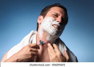 Man Gritting Teeth Shaving With Razor Burn Bumps Rash Ingrown Hair