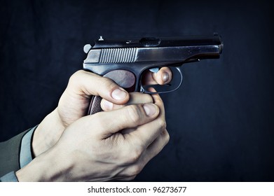 Man With Gun. Russian Handgun Pm (Makarov) In Male Hands