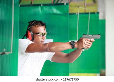 Man With Gun At Shooting Range