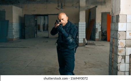 Man with gun, zombie apocalypse, abandoned factory