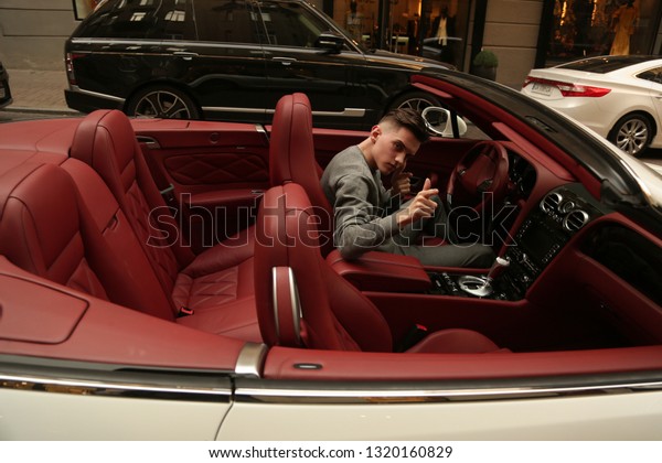 Man, guy, car,  Lux, luxury, glasses, young, male.\
Bentley. supercar. super car. Sexy guy, sexy man, Attractive.\
Comfort, rich. Vehicle. Auto, automobile. Success, successful.\
Happy dream. nice, 