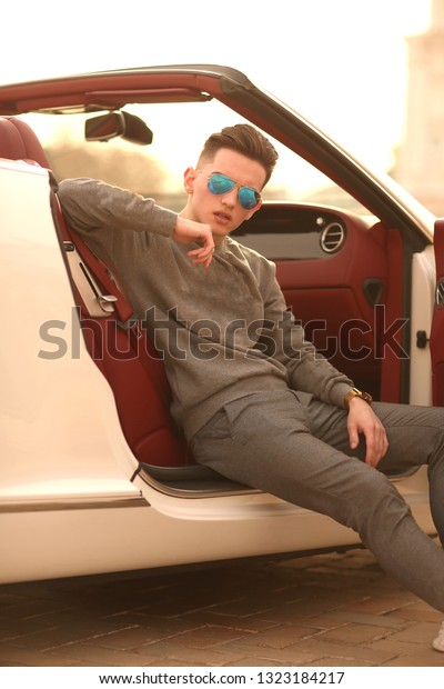 Man, guy, car,  Lux, luxury, young, male. Bentley.\
supercar, super car, glasses. Sexy guy, sexy man, Attractive.\
Comfort, rich. Vehicle. Auto, automobile. Success, successful.\
Happy dream. nice, 