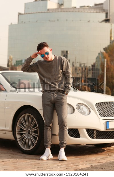 Man, guy, car,  Lux, luxury, young, male. Bentley.
supercar, super car, glasses. Sexy guy, sexy man, Attractive.
Comfort, rich. Vehicle. Auto, automobile. Success, successful.
Happy dream. nice, 