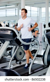 Man At The Gym Doing Exercise On The Treadmill