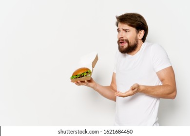 A man with hamburger boxes and cropped view