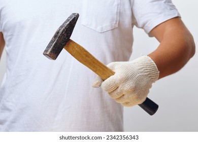 man with hammer in gloves - Shutterstock ID 2342356343