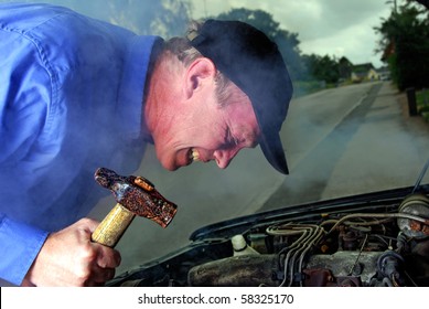 Man With A Hammer Trying To Smash His Broken Down Car At Night