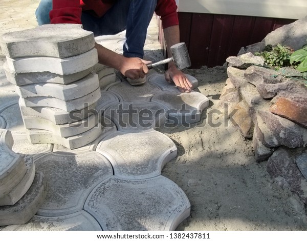 laying patio slabs on sand and cement