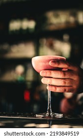 Man Hand Bartender Holding Cocktail In Glass On The Bar Counter