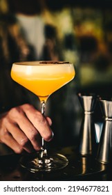 Man Hand Bartender Holding Cocktail In Glass On The Bar Counter