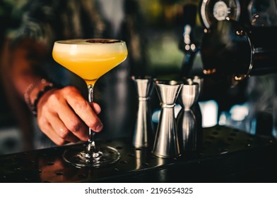 Man Hand Bartender Holding Cocktail In Glass On The Bar Counter